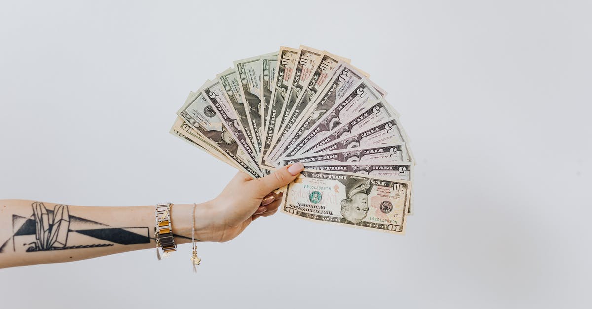 Cash basis salary for uk visa - Hand Holding Fan of Us Dollar Bills Cash basis salary for uk visa - Hand Holding Fan of Us Dollar Bills
