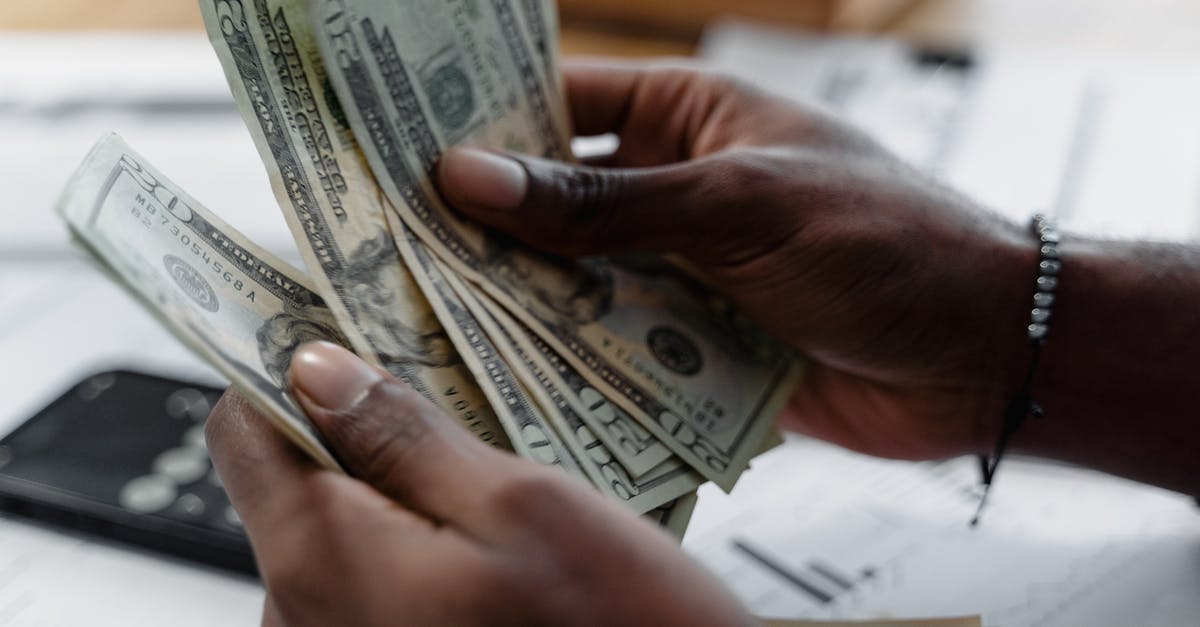 Cash limit counting in traveling to US - A Person Counting Money Cash limit counting in traveling to US - A Person Counting Money