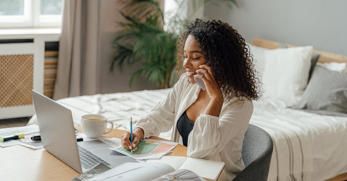 Cellphone carriers in Europe - Woman in White Long Sleeve Shirt Sitting on Gray Couch Cellphone carriers in Europe - Woman in White Long Sleeve Shirt Sitting on Gray Couch