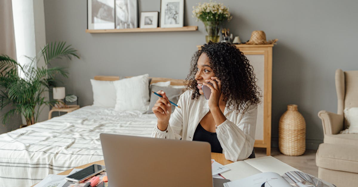 Cellphone carriers in Europe - Woman in White Long Sleeve Shirt Sitting on Chair Cellphone carriers in Europe - Woman in White Long Sleeve Shirt Sitting on Chair