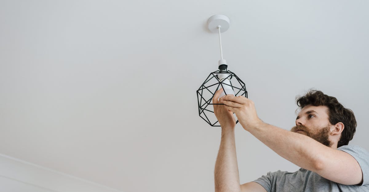 Change of status from an F-1 to B -1/ B-2 - Man screwing light bulb into lamp Change of status from an F-1 to B -1/ B-2 - Man screwing light bulb into lamp