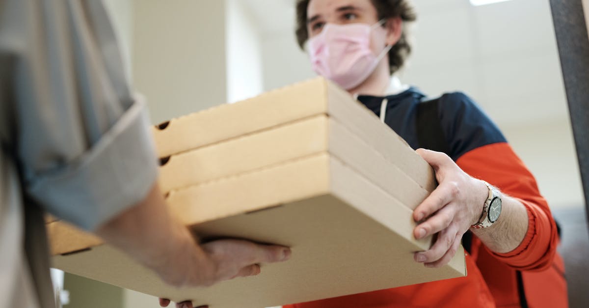Change the address of stay after receiving Schengen visa - Man Wearing a Face Mask Delivering Pizza Change the address of stay after receiving Schengen visa - Man Wearing a Face Mask Delivering Pizza