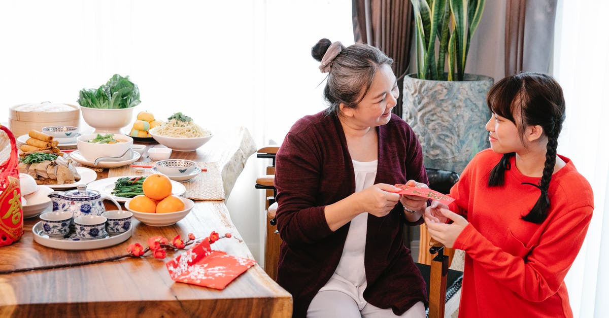 Changing flights after receiving Chinese visa (and some other questions) - Smiling Asian grandma talking to granddaughter during New Year holiday Changing flights after receiving Chinese visa (and some other questions) - Smiling Asian grandma talking to granddaughter during New Year holiday