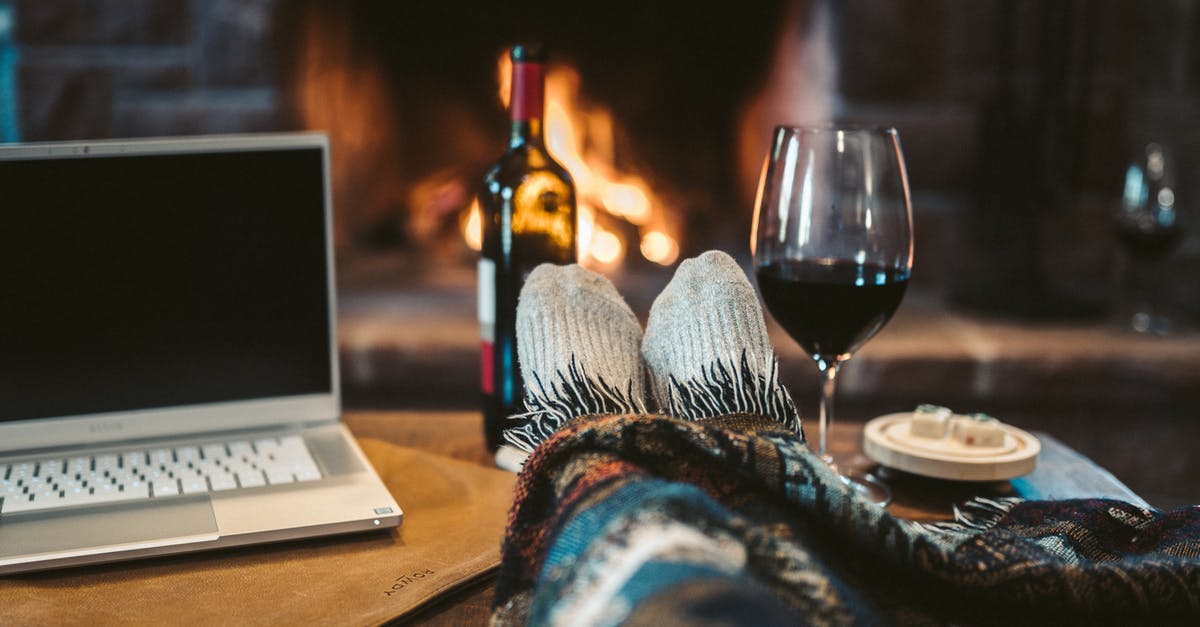 Changing purpose of stay from travel to work in Schengen - Macbook Pro Beside Wine Glass on Brown Wooden Table Changing purpose of stay from travel to work in Schengen - Macbook Pro Beside Wine Glass on Brown Wooden Table