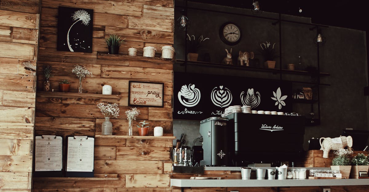 Cheap cafe or restaurant with Wi-Fi in Jincheng, Yunnan, China? - Assorted Decors With Brown Rack Inside Store Cheap cafe or restaurant with Wi-Fi in Jincheng, Yunnan, China? - Assorted Decors With Brown Rack Inside Store