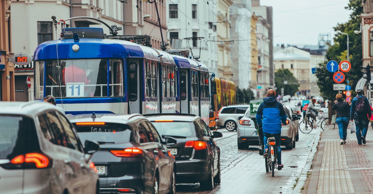 Cheapest transport (other than walking) from ACY to touristy area in Atlantic City - Modern vehicles driving slowly with riding cyclist on busy road in city while people walking and sidewalk near old buildings Cheapest transport (other than walking) from ACY to touristy area in Atlantic City - Modern vehicles driving slowly with riding cyclist on busy road in city while people walking and sidewalk near old buildings