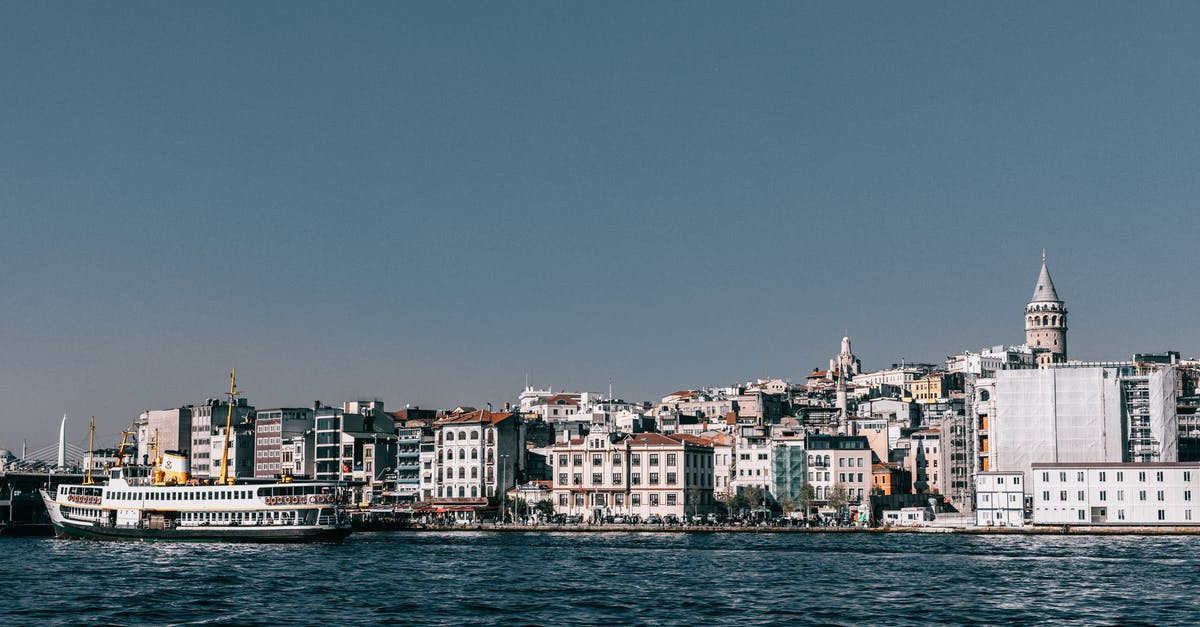 Cheapest transport to go to Istanbul from Van(Turkey) - Ship floating in sea near coastal city Cheapest transport to go to Istanbul from Van(Turkey) - Ship floating in sea near coastal city