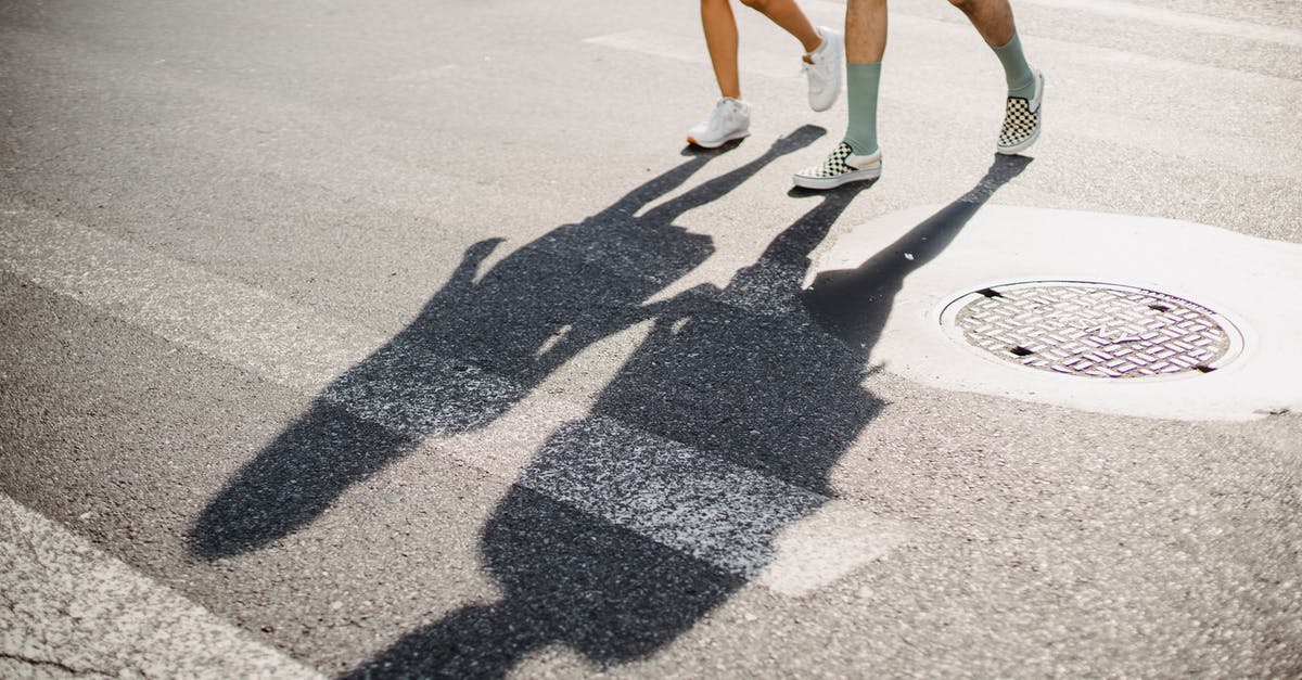 Cheapest way from Frankfurt Hahn to Wiesbaden? [closed] - Young couple crossing road on crosswalk