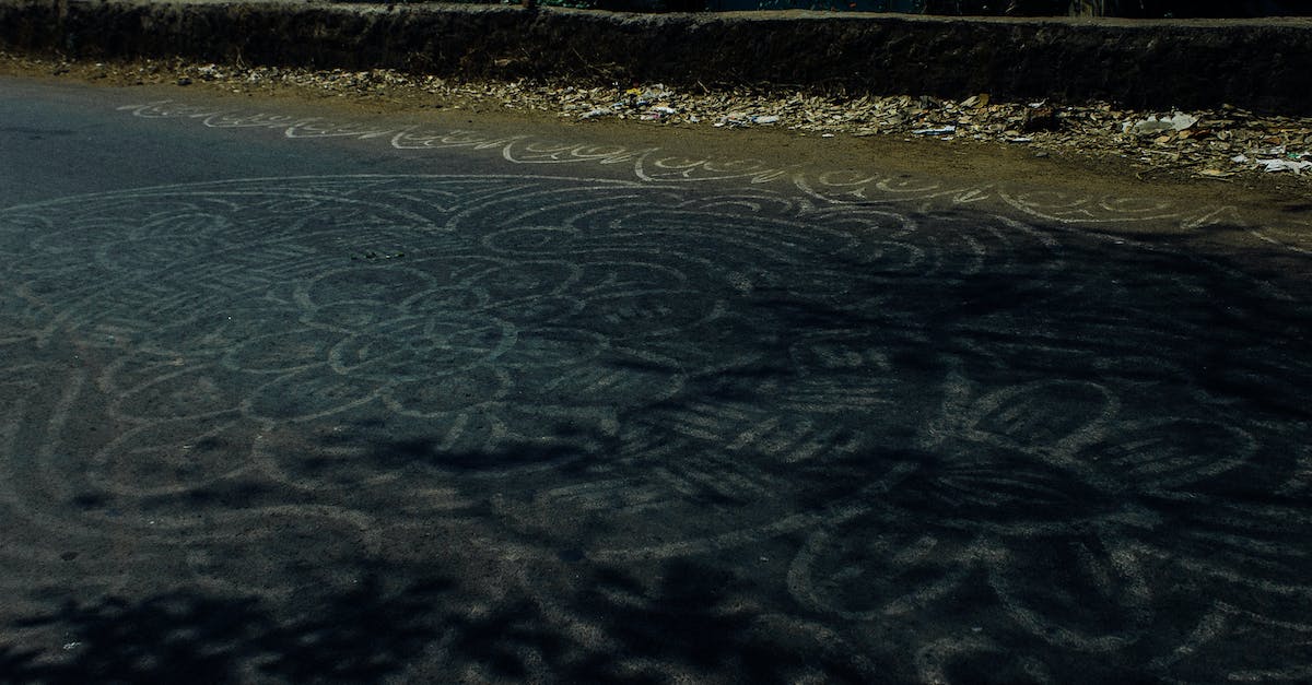 Cheapest way to get HON circle status? - Pale white abstract mandala ornament painted on asphalt road in rural area in daylight Cheapest way to get HON circle status? - Pale white abstract mandala ornament painted on asphalt road in rural area in daylight