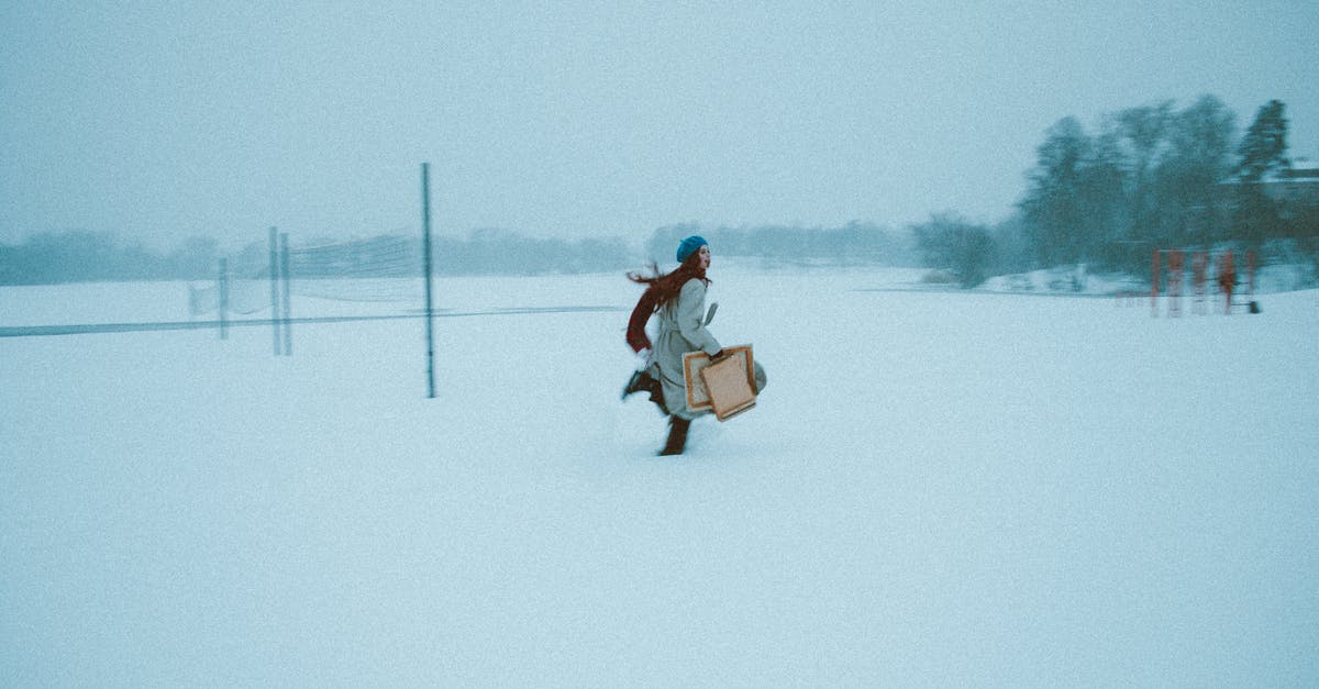 Checking bags through on separate OneWorld bookings? - Woman Running Through Snow while Holding Packages Checking bags through on separate OneWorld bookings? - Woman Running Through Snow while Holding Packages