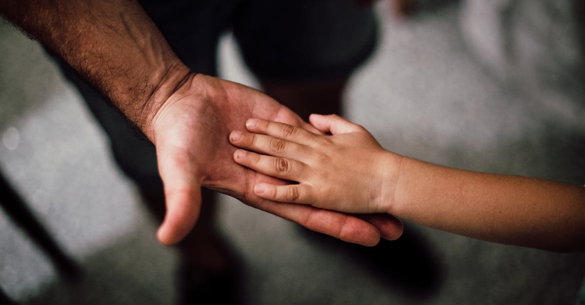 Child passport validity - Selective Focus Photography of Child's Hand Child passport validity - Selective Focus Photography of Child's Hand