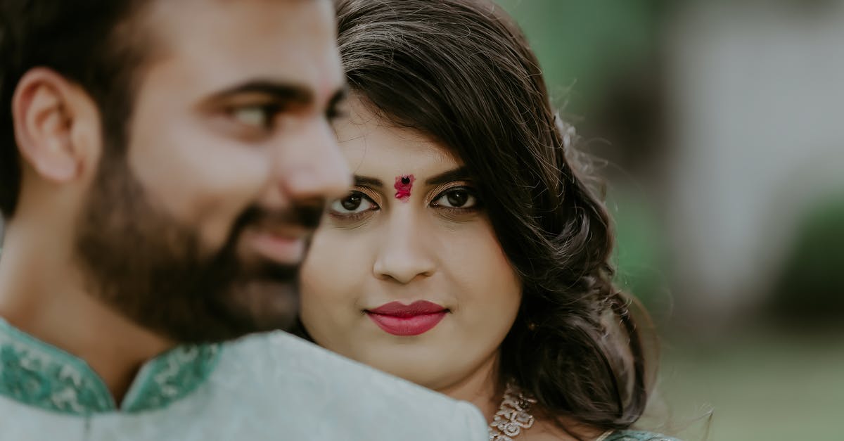 Chinese national, UK residency, supported by partner - how to to get a Schengen visa? - Cheerful couple of husband and wife in national wearing with bindi in soft focus Chinese national, UK residency, supported by partner - how to to get a Schengen visa? - Cheerful couple of husband and wife in national wearing with bindi in soft focus