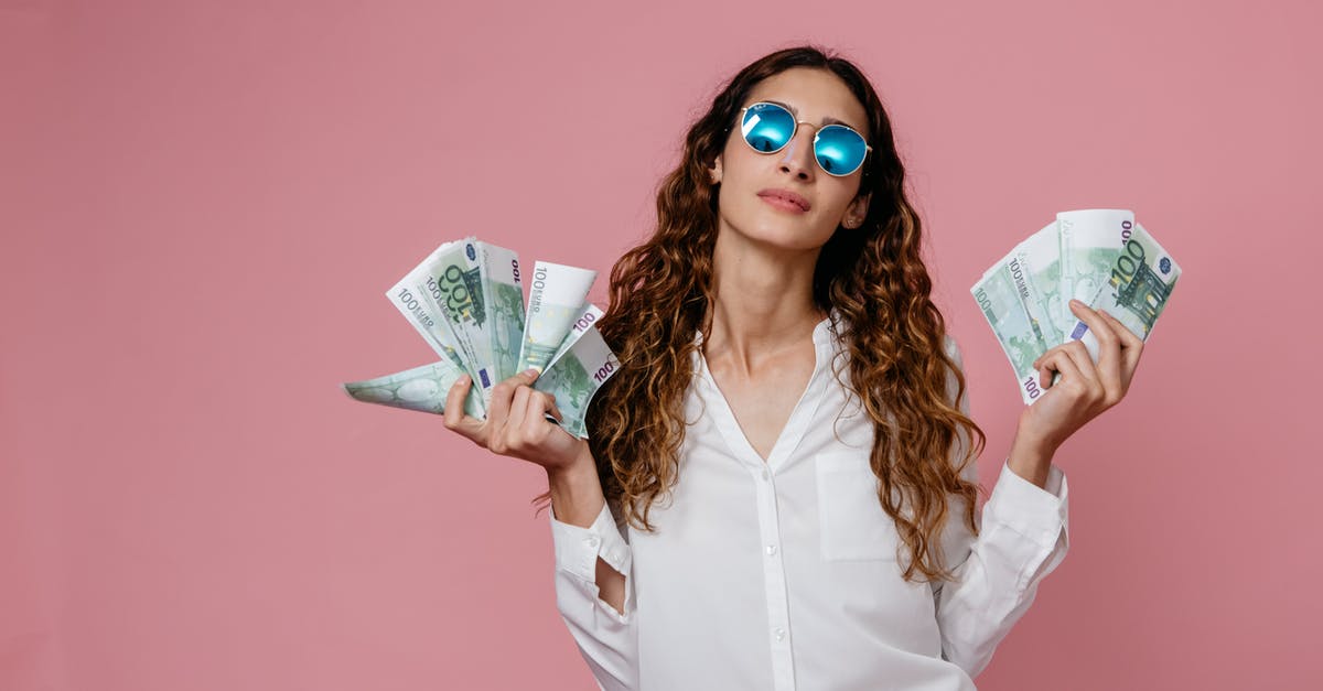 Citibank Cash withdrawal in Barcelona - A Woman in White Long Sleeve Button Up Shirt Holding Bank Notes Citibank Cash withdrawal in Barcelona - A Woman in White Long Sleeve Button Up Shirt Holding Bank Notes