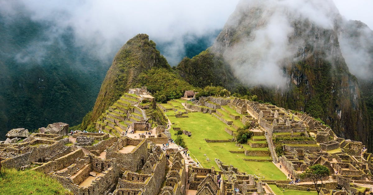 Climate in Peru in September - Brown Houses on Green Grass Field Near Mountain Climate in Peru in September - Brown Houses on Green Grass Field Near Mountain