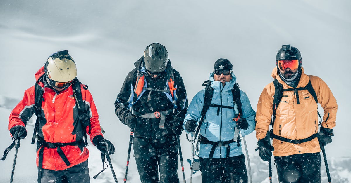 Closest skiing to Indochina - 3 Person Wearing Snow Goggles and Orange Jacket Standing on Snow Covered Ground Closest skiing to Indochina - 3 Person Wearing Snow Goggles and Orange Jacket Standing on Snow Covered Ground