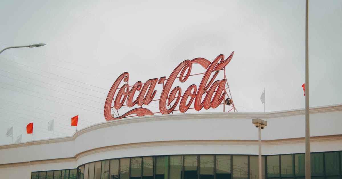 Company name spelled incorrectly - Coca Cola Sign on a Building