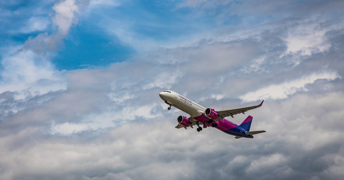 Compensation for a flight going somewhere else - White and Red Airplane Flying Under Blue Sky and White Clouds Compensation for a flight going somewhere else - White and Red Airplane Flying Under Blue Sky and White Clouds