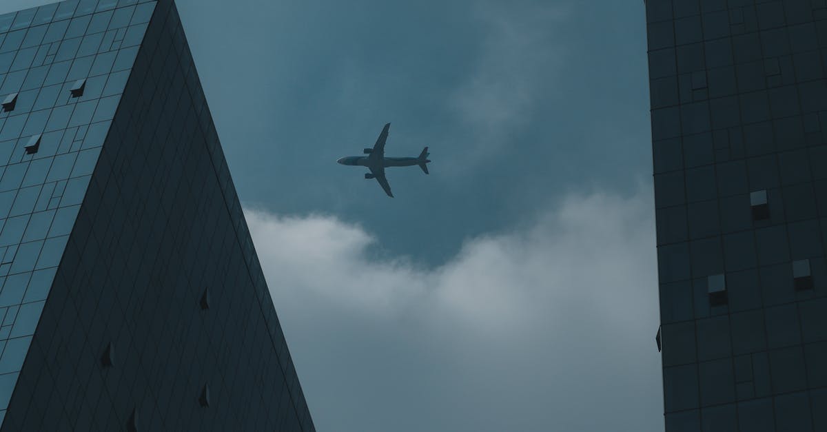 Compensation for cancelled flight - comparable means of transportation - Airplane Flying above Buildings Compensation for cancelled flight - comparable means of transportation - Airplane Flying above Buildings