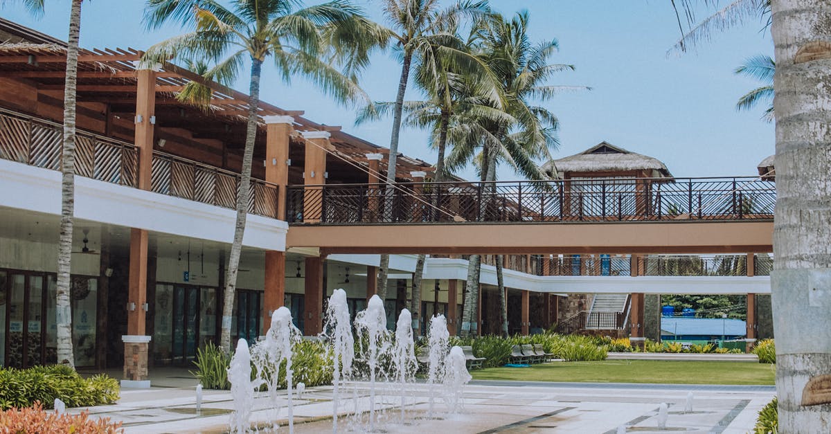 Compensation for Hotel or Travel Package - White Concrete Building Near Palm Trees Compensation for Hotel or Travel Package - White Concrete Building Near Palm Trees
