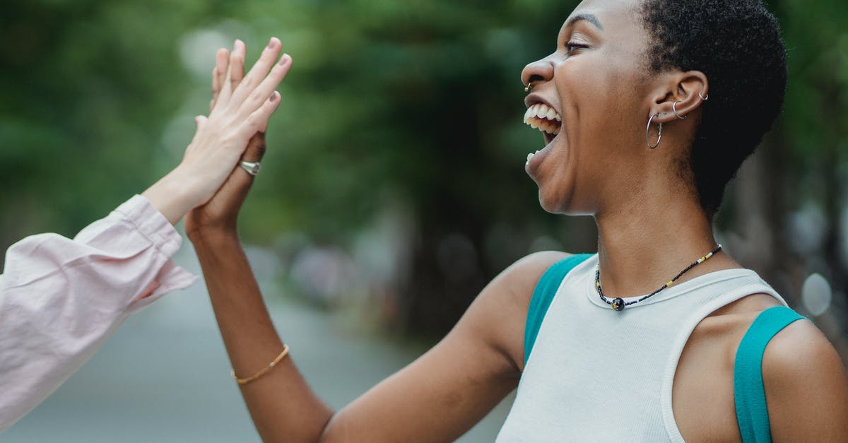Comprehensive health and travel insurance that meets NZ Immigration requirements - Happy Woman Doing A High Five Comprehensive health and travel insurance that meets NZ Immigration requirements - Happy Woman Doing A High Five
