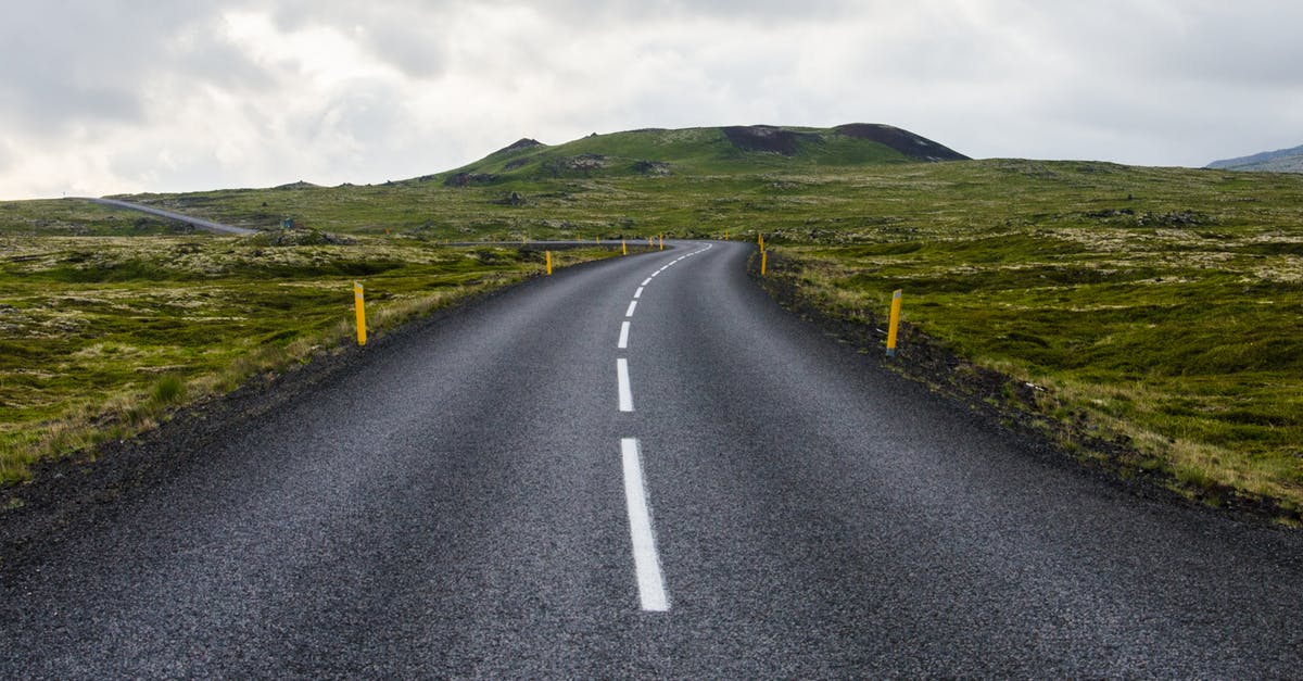 Concerns with long-distance driving - Gray Concrete Road Towards Green Mountain Concerns with long-distance driving - Gray Concrete Road Towards Green Mountain
