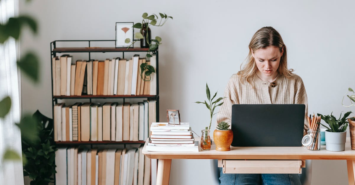 Confusion about the online booking of Lego House tickets - Concentrated freelancer working on laptop at home desk Confusion about the online booking of Lego House tickets - Concentrated freelancer working on laptop at home desk