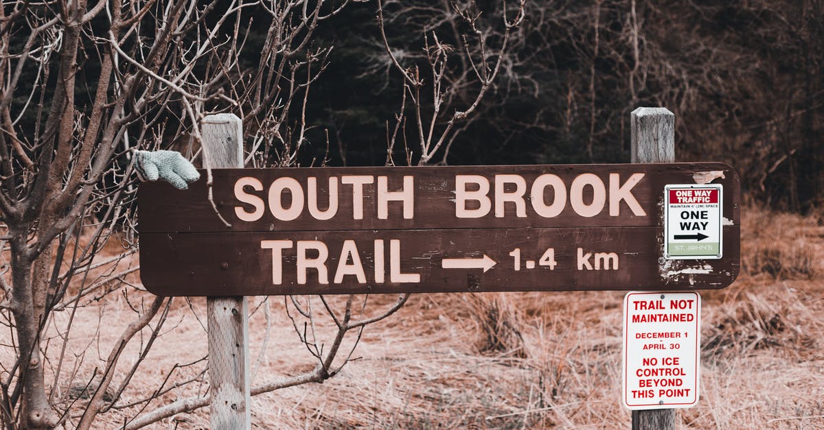 Confusion in submitting Documents for Canada Tourist Visa stamping - Wooden sign with direction to South Brook trail placed near inscriptions and leafless trees near dry grass in countryside in autumn day Confusion in submitting Documents for Canada Tourist Visa stamping - Wooden sign with direction to South Brook trail placed near inscriptions and leafless trees near dry grass in countryside in autumn day