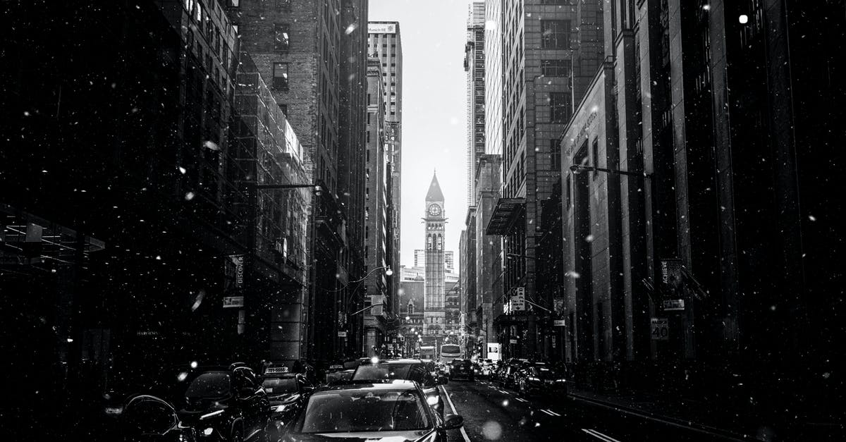 Connecting in Toronto on different airlines - Monochrome Photo Of City During Daytime Connecting in Toronto on different airlines - Monochrome Photo Of City During Daytime