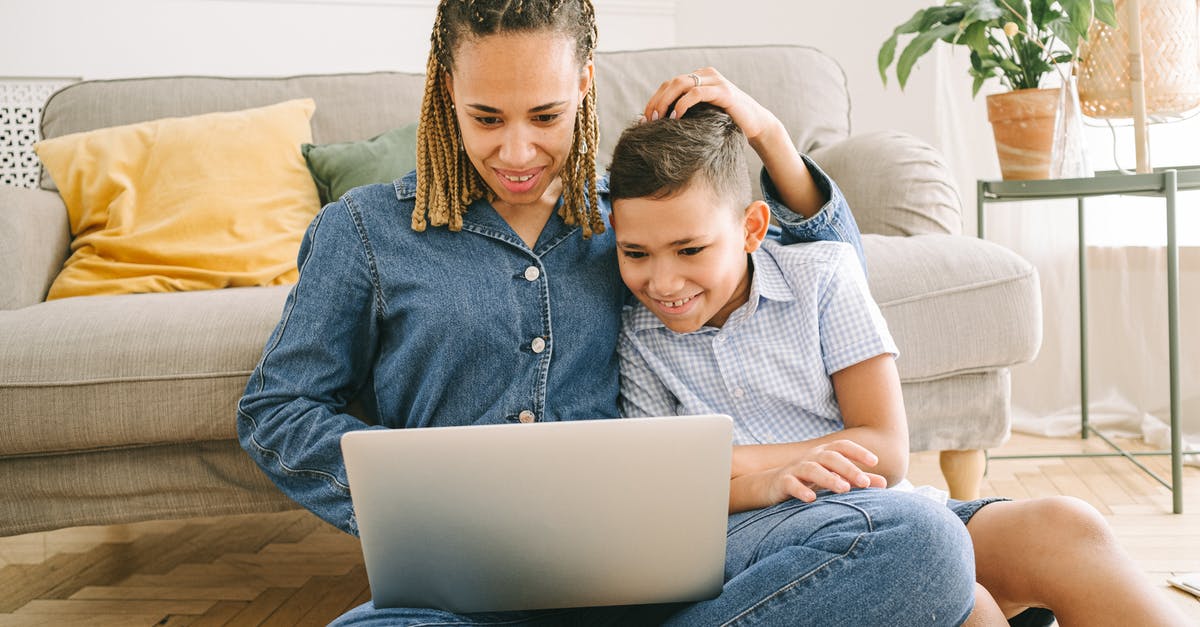 Consequences of accidentally holding onto two Indian passports simultaneously? - Woman and Young Boy Sitting on Floor with Laptop Consequences of accidentally holding onto two Indian passports simultaneously? - Woman and Young Boy Sitting on Floor with Laptop
