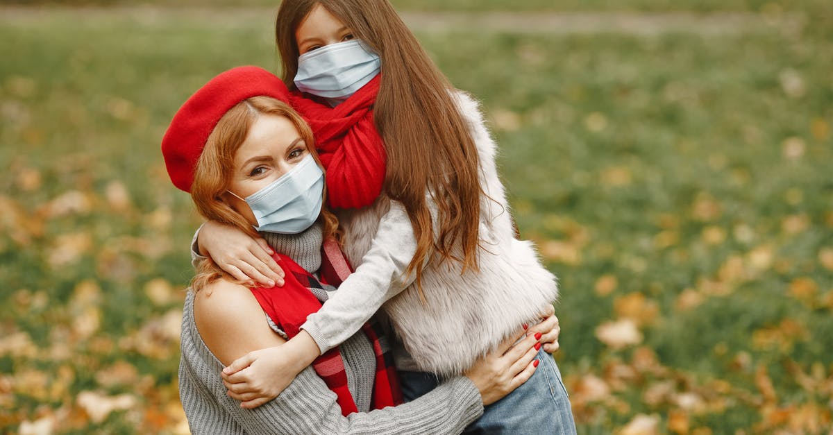Coronavirus affected co-passenger; what to do? - Girl Hugging Woman In Gray Sweater Coronavirus affected co-passenger; what to do? - Girl Hugging Woman In Gray Sweater