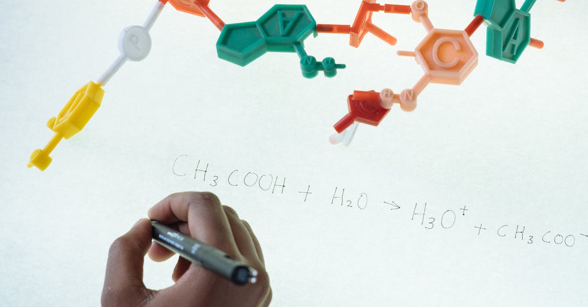 COVID-19 - show negative PCR test results at boarding at layover or at check-in in starting airport? - Anonymous chemist writing with marker on illuminated magnetic board formula of Hydronium and Acetate production after studying plastic model of molecule in laboratory