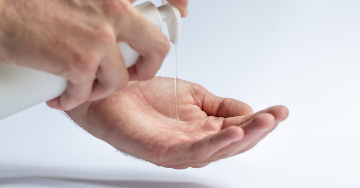 Covid19 B2 visa extension online- response from USCIS - Crop anonymous male pouring antibacterial soap sanitizer for preventing spread of diseases and avoid infections Covid19 B2 visa extension online- response from USCIS - Crop anonymous male pouring antibacterial soap sanitizer for preventing spread of diseases and avoid infections