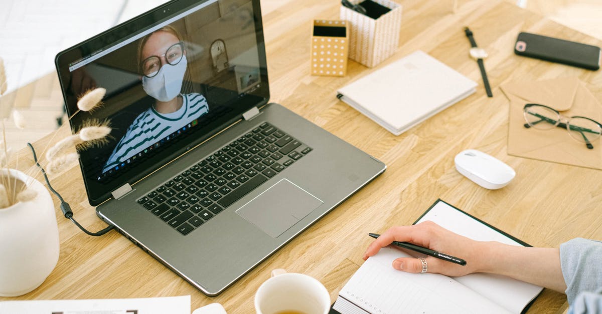 Covid restrictions based on originating or connecting locations? - Woman Having Video Call in Home Office Covid restrictions based on originating or connecting locations? - Woman Having Video Call in Home Office
