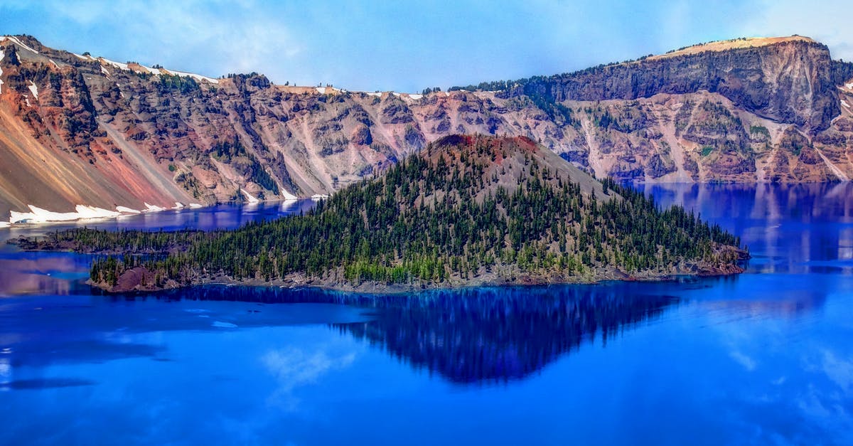 Crater Lake Oregon - can you sleep in your car at night? - Island on Blue Water Surrounded by Moutain Crater Lake Oregon - can you sleep in your car at night? - Island on Blue Water Surrounded by Moutain