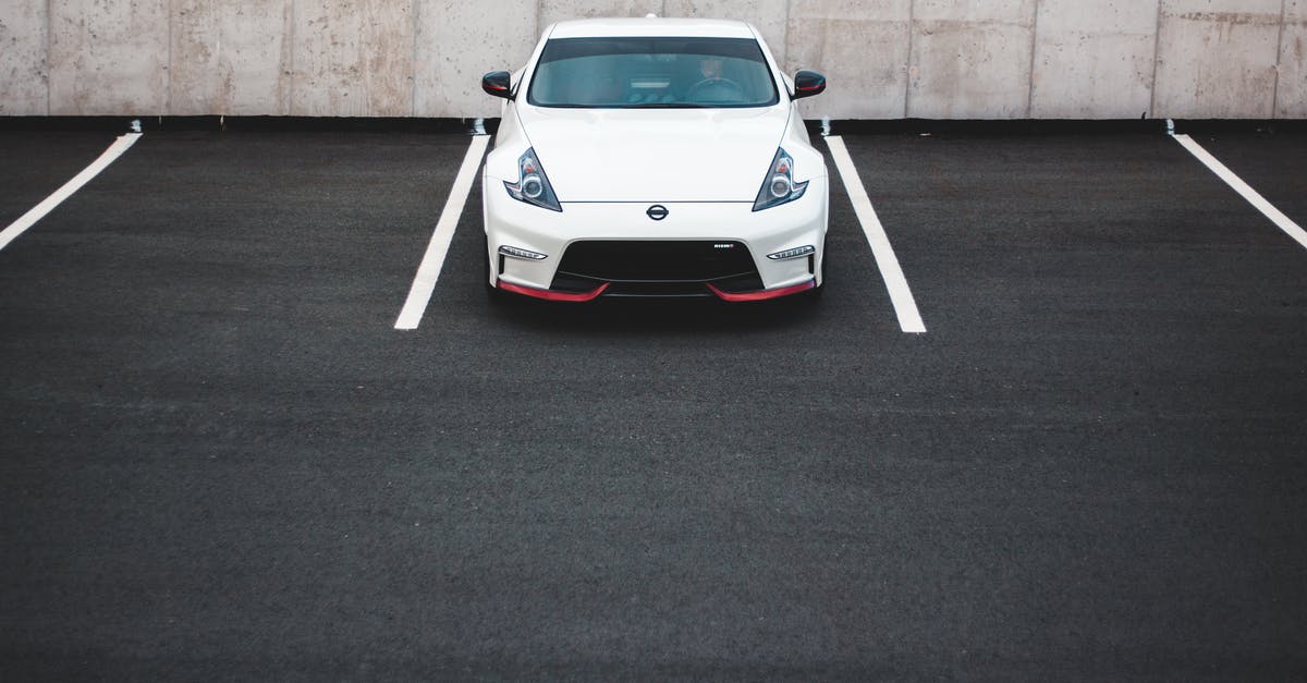 Creative ways to get from NY City to New Haven CT not using cars/vans [closed] - Modern car on parking lot near dirty wall in town