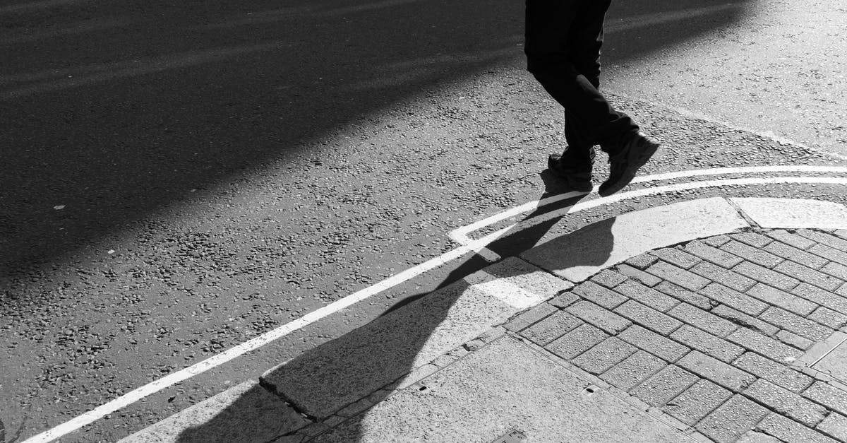 Crossing Swiss-Austrian border by foot - A Person Crossing the Street Crossing Swiss-Austrian border by foot - A Person Crossing the Street