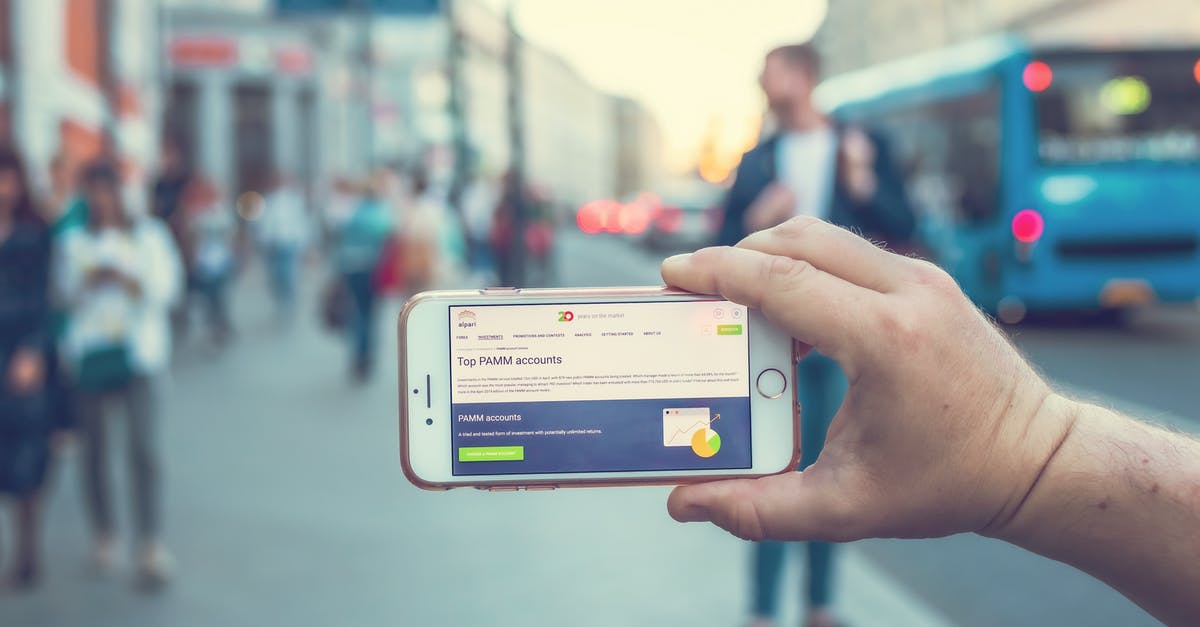 Cuban currency exchange - ATM vs exchange office - A Person Holding a White and Gray Smartphone Cuban currency exchange - ATM vs exchange office - A Person Holding a White and Gray Smartphone