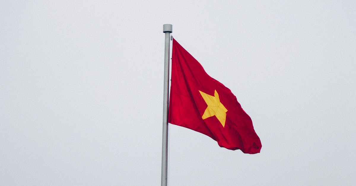Currently in a UK red list country. Can I travel to a country that's not in red list and then travel to UK? - Red and Yellow Flag Close-up Photography Currently in a UK red list country. Can I travel to a country that's not in red list and then travel to UK? - Red and Yellow Flag Close-up Photography