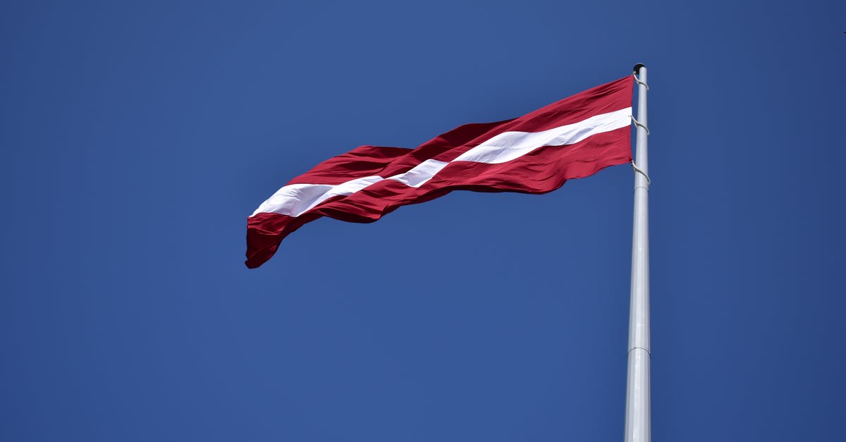 Currently in a UK red list country. Can I travel to a country that's not in red list and then travel to UK? - Red and White State Flag Waving Under Blue Sky at Daytime Currently in a UK red list country. Can I travel to a country that's not in red list and then travel to UK? - Red and White State Flag Waving Under Blue Sky at Daytime