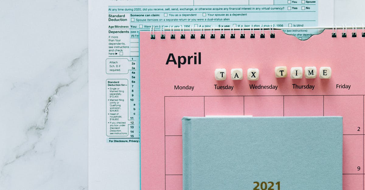 Customs officer stamp for one year - Tax Return Form and 2021 Planner on the Table Customs officer stamp for one year - Tax Return Form and 2021 Planner on the Table