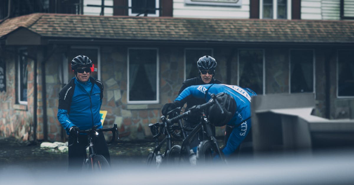 Cycling safety in Romania / Poland - Two Man Riding Black Mountain Bikes Cycling safety in Romania / Poland - Two Man Riding Black Mountain Bikes