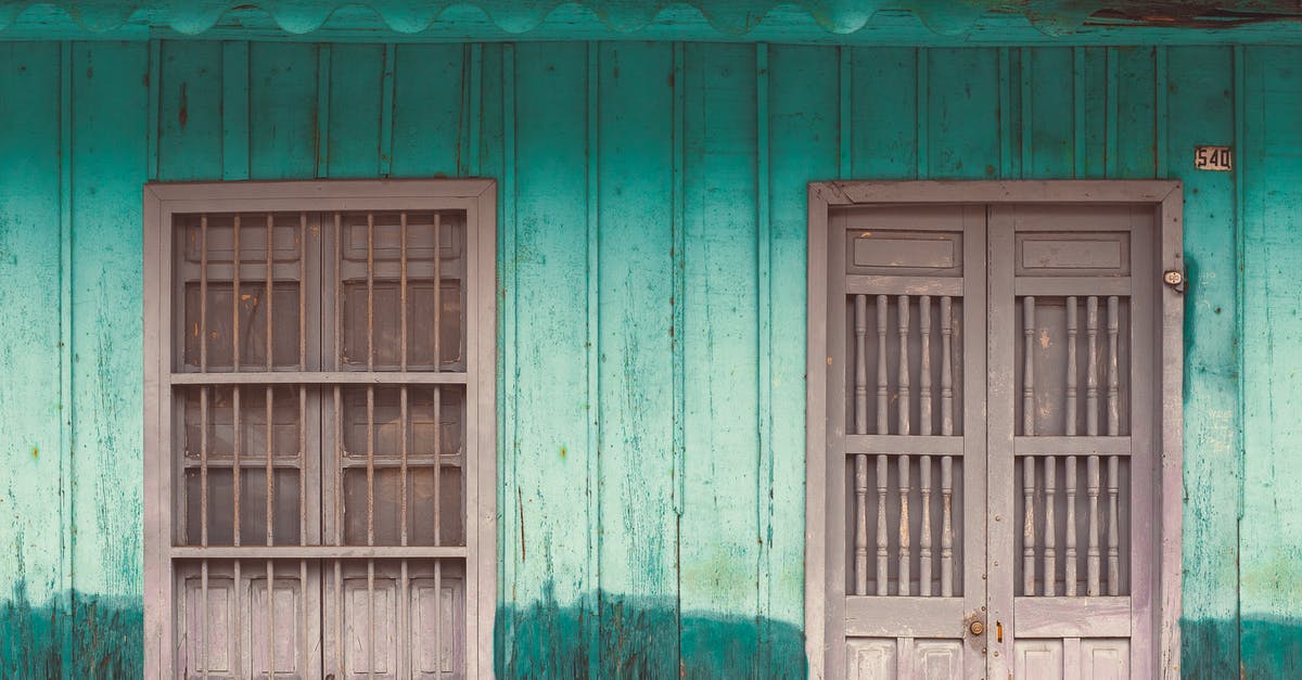 Damaged Indian passport - Blue Wooden Window Frame on White and Brown Concrete Wall Damaged Indian passport - Blue Wooden Window Frame on White and Brown Concrete Wall
