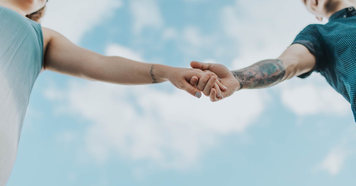 Date Limitation of Low Fares in Far East - Couple Holding Each Others Hands Date Limitation of Low Fares in Far East - Couple Holding Each Others Hands