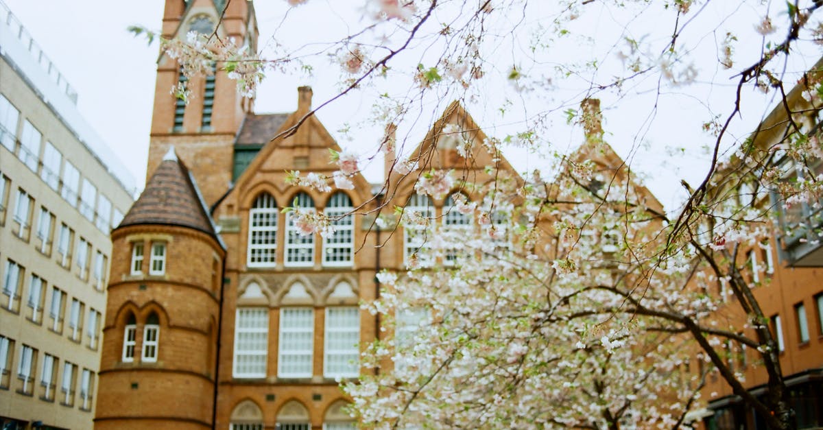 Dates for travel to Antarctica in local spring - Exterior of historic building with clock on spire in Birmingham on clear spring day Dates for travel to Antarctica in local spring - Exterior of historic building with clock on spire in Birmingham on clear spring day
