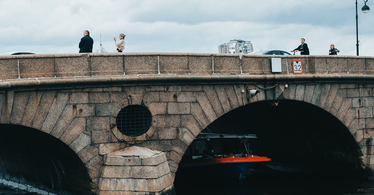 Day trips from Addis Ababa with public transport. Is it possible? - Tourists on big bridge over small passenger ship sailing on river in daytime Day trips from Addis Ababa with public transport. Is it possible? - Tourists on big bridge over small passenger ship sailing on river in daytime