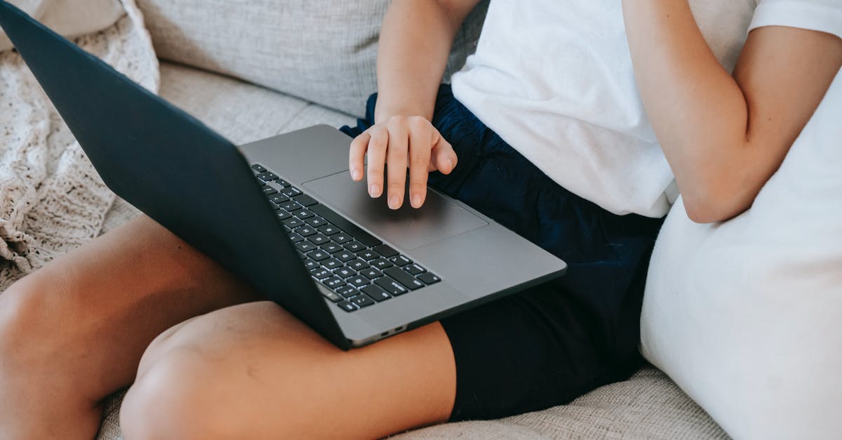 Day use/hourly rooms convenient to SFO or Sunnyvale? - From above of crop unrecognizable self employed young lady in casual clothes sitting on comfortable couch and working online on laptop at home Day use/hourly rooms convenient to SFO or Sunnyvale? - From above of crop unrecognizable self employed young lady in casual clothes sitting on comfortable couch and working online on laptop at home