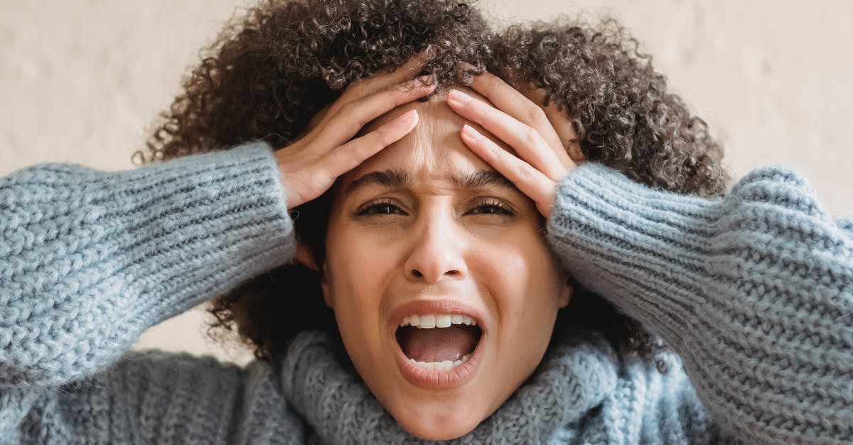 Dealing with aggressive touts in markets? - Expressive African American woman with curly brown hair touching head and yelling against light background Dealing with aggressive touts in markets? - Expressive African American woman with curly brown hair touching head and yelling against light background