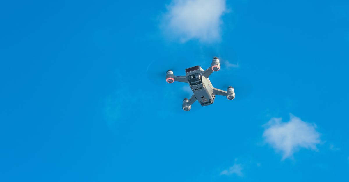 Delta: Flight from PHL to LAS with connecting at ATL - White uav with spinning motors in air