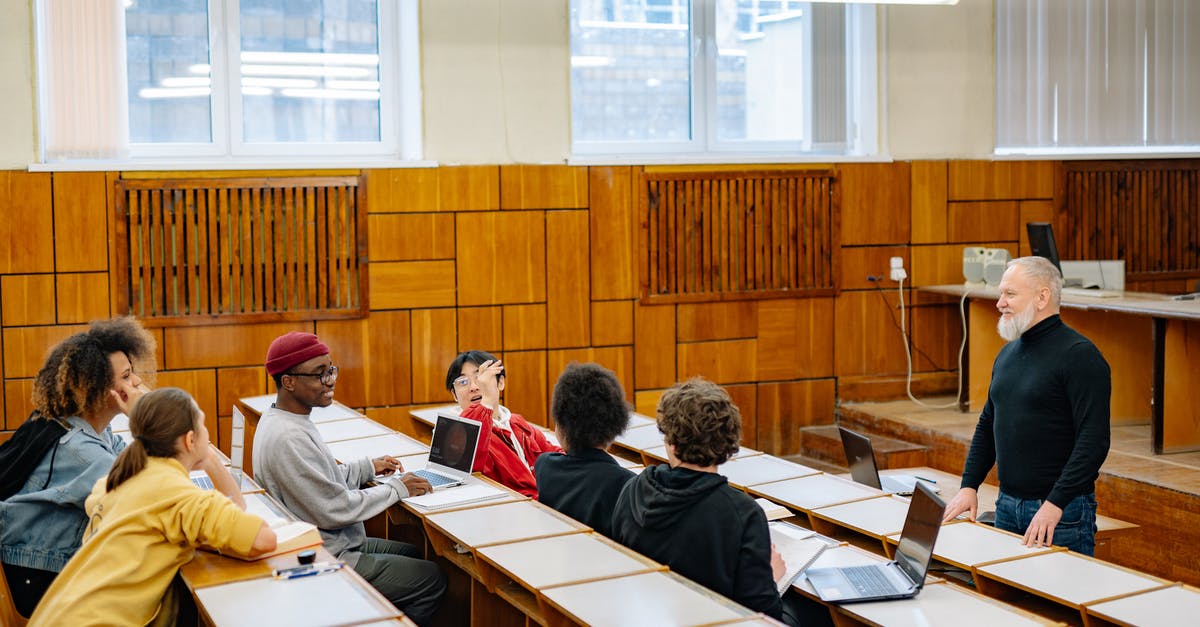 Dependent visa for Masters students in Germany - People Sitting on Chair in Front of Table Dependent visa for Masters students in Germany - People Sitting on Chair in Front of Table