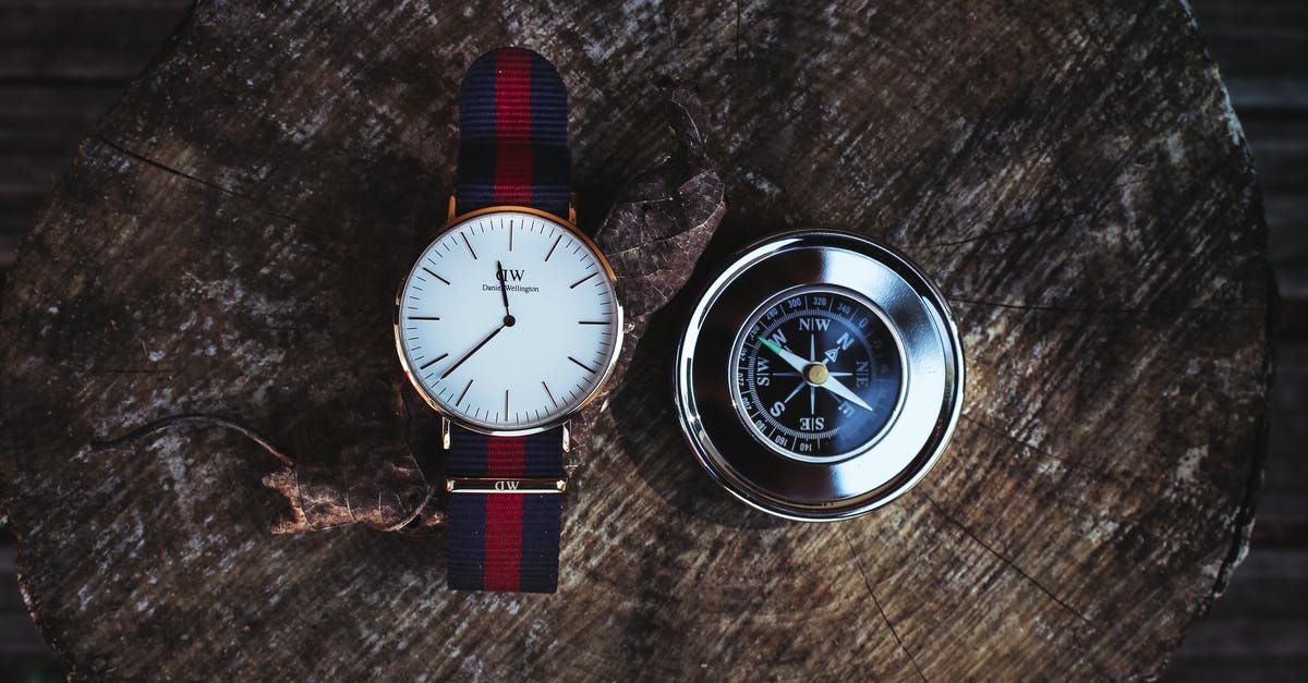 Deported from airport within 24 hours - Round Silver-colored Analog Watch Beside Compass Deported from airport within 24 hours - Round Silver-colored Analog Watch Beside Compass